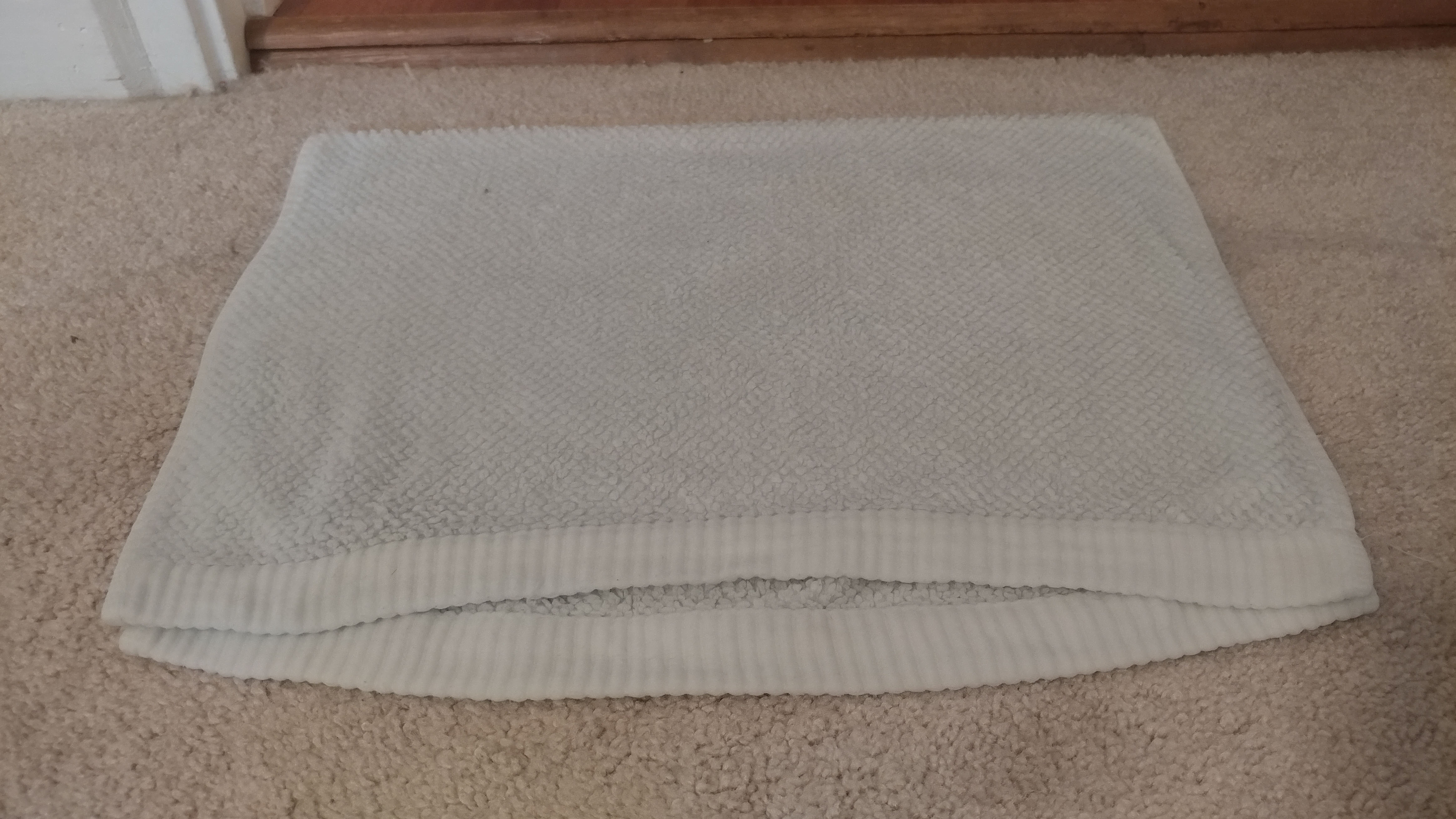 Step 2: Soak an old towel or rag in hot water and lay it on top of the stain.